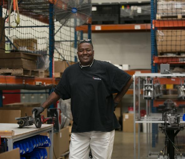 man in front of machinery